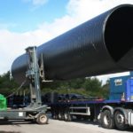 Forklift Moving an Oversized Load Onto a Truck