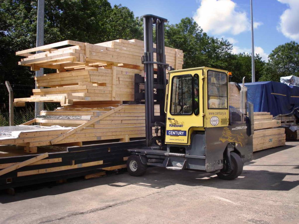 Sideloader Forklift Being Used to Move Lumber