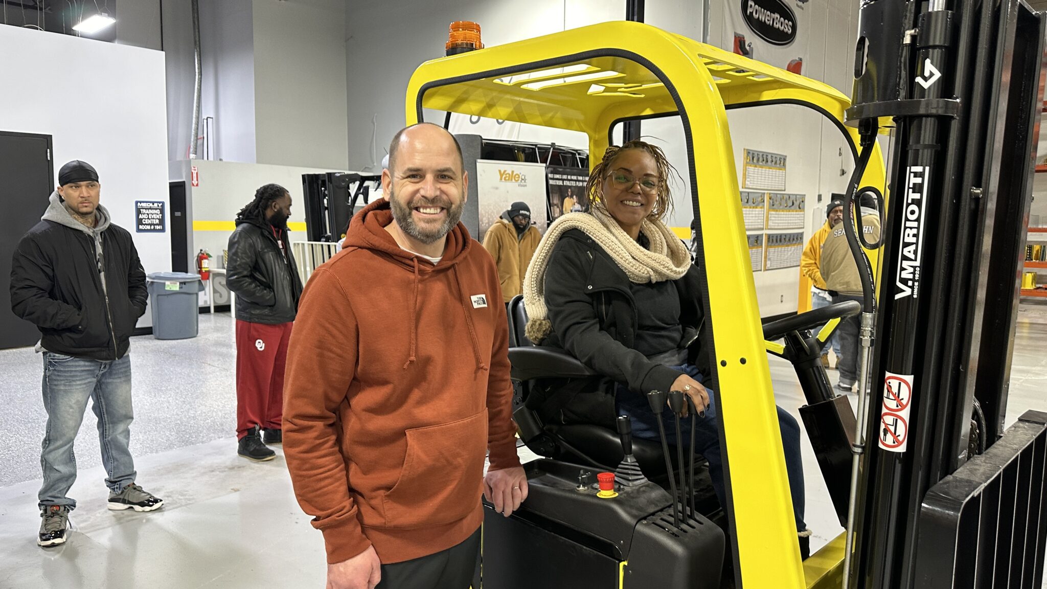 Pictured here, Medley Equipment Company, Brandon Kirkpatrick, Training and Business Development Manager posing with  Sharryc Smith, M.S., BHCMII 
Assistant Advocate Counselor, Reentry Employment Specialist
Urban League of Greater Oklahoma City before giving her a hands-on demonstration of Medley donated Lift Truck by Mariotti.
